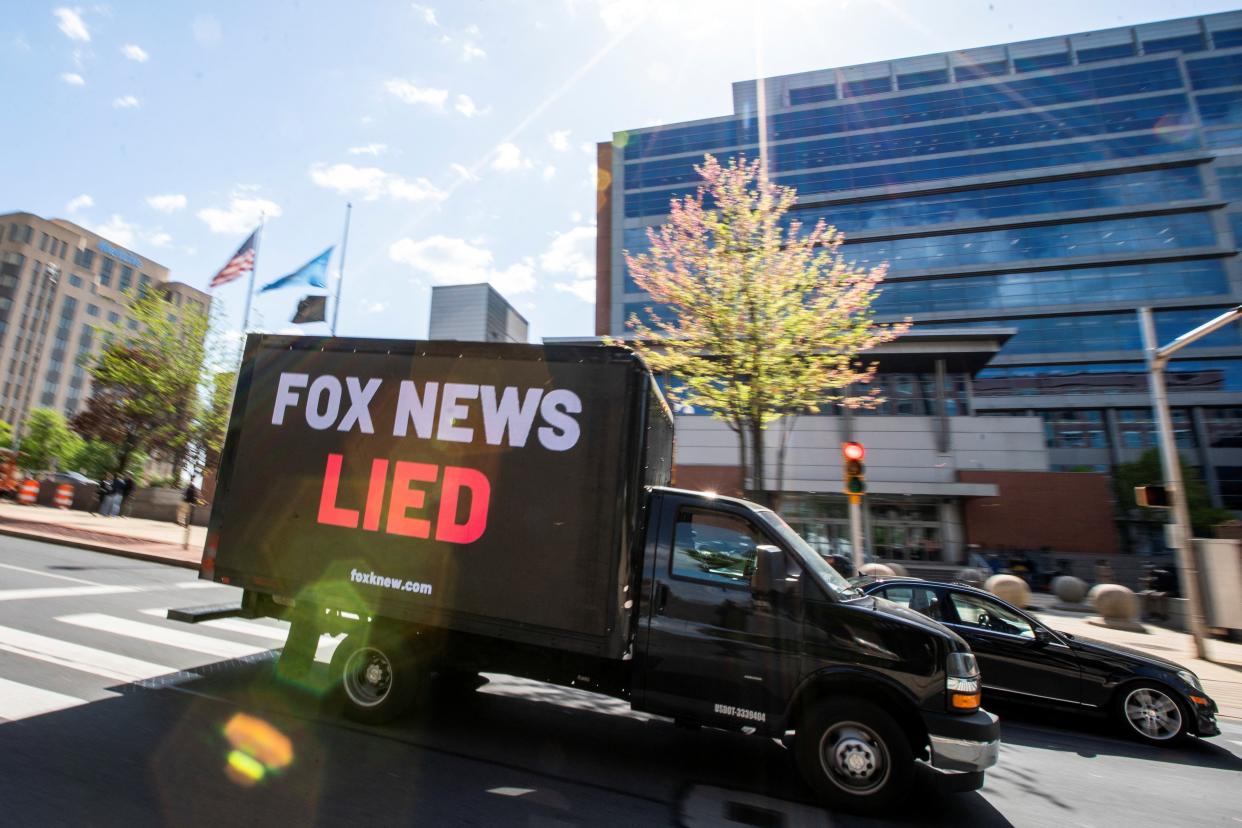 A truck drives in front of the courthouse as jury selection continues in Dominion Voting Systems' $1.6 billion defamation lawsuit against Fox over its coverage of debunked election-rigging claims, in Delaware Superior Court in Wilmington, Delaware (REUTERS)