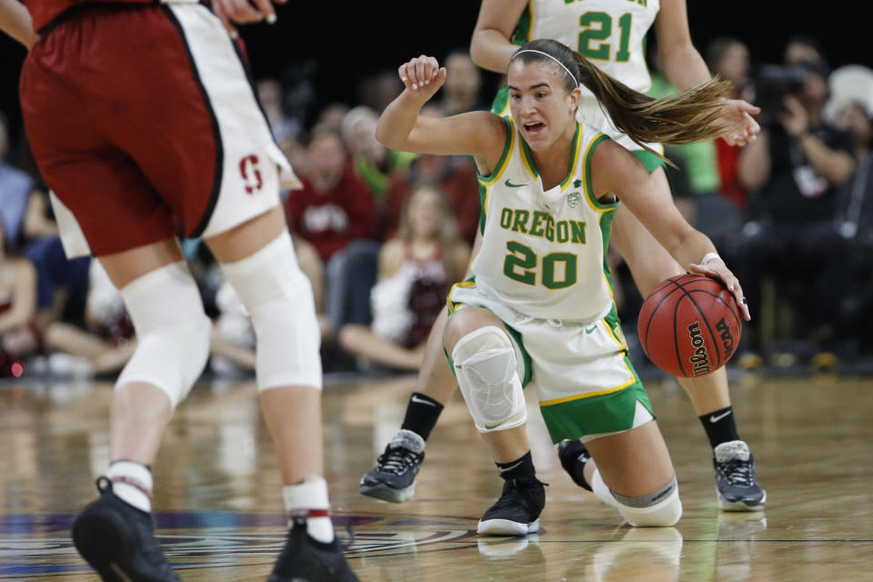 Oregon's Sabrina Ionescu (20) dribbles the ball against Stanford during the second half of an NCAA college basketball game in the final of the Pac-12 women's tournament Sunday, March 8, 2020, in Las Vegas. (AP Photo/John Locher)