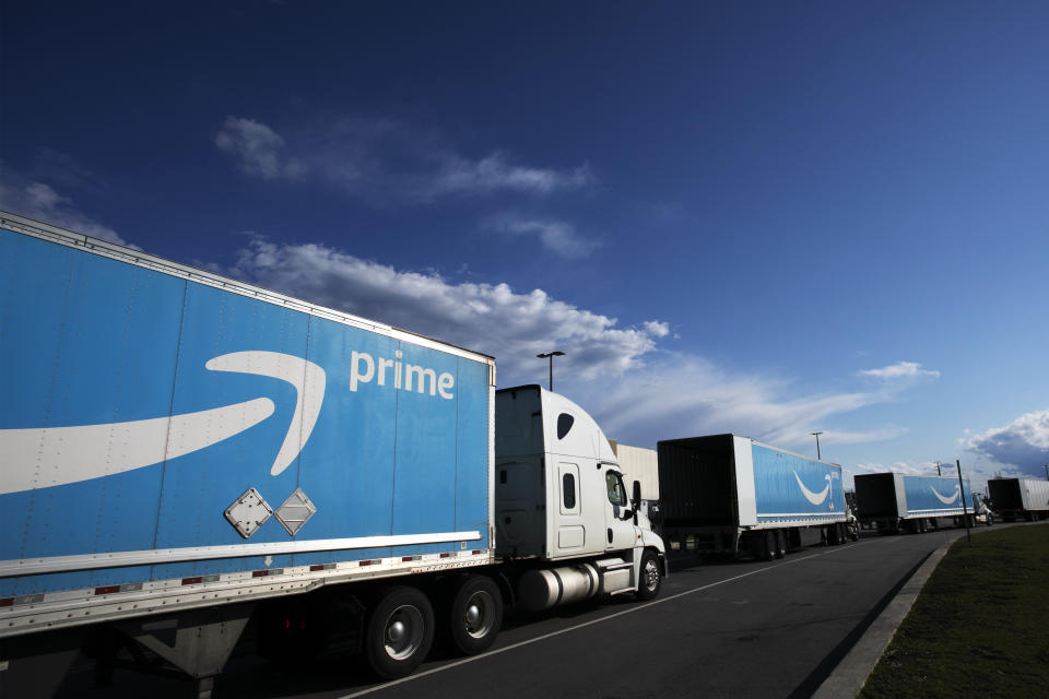 FILE - Amazon tractor trailers line up outside the Amazon distribution center on April 21, 2020 on Staten Island in New York. Two years after clenching a historic union victory at the Amazon facility, the Amazon Labor Union is divided, running out of money and fighting over an election that could determine who will lead the group in the near future. (AP Photo/Mark Lennihan, File)