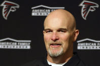 FILE - In this Dec. 15, 2019, file photo, Atlanta Falcons head coach Dan Quinn speaks at a news conference after an NFL football game against the San Francisco 49ers in Santa Clara, Calif. The heat is on — and the games haven't even kicked off yet. That's life in the NFL for some coaches who enter the regular season knowing they need to guide their squads through what will be a most unusual regular season and at least keep them in playoff contention into December. (AP Photo/John Hefti, File)