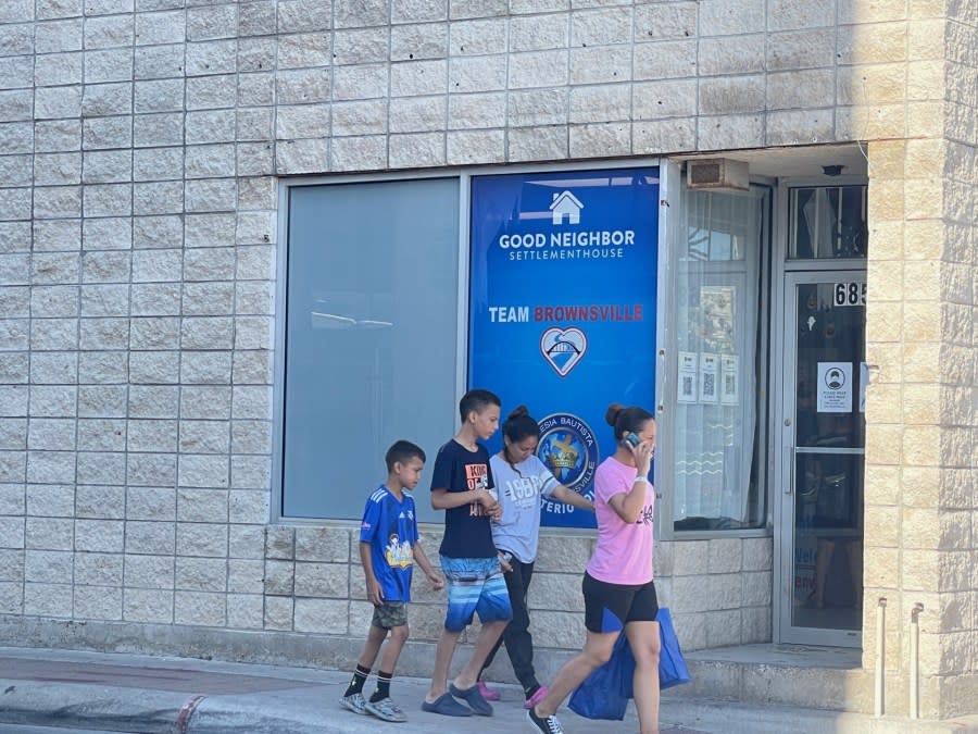 A migrant family enters the Welcome Center in Brownsville, Texas, on Oct. 20, 2023. (Sandra Sanchez/Border Report)