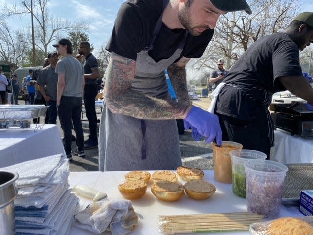 Caleb Stangroom prepares buns during the "OKC's Best Burger Competition & Tasting at VZD's Restaurant and Bar in Oklahoma City. Stangroom will collaborate with chef Zach Hutton at GHST to bring to life the first pop-up for his new Tiger Style concept.
