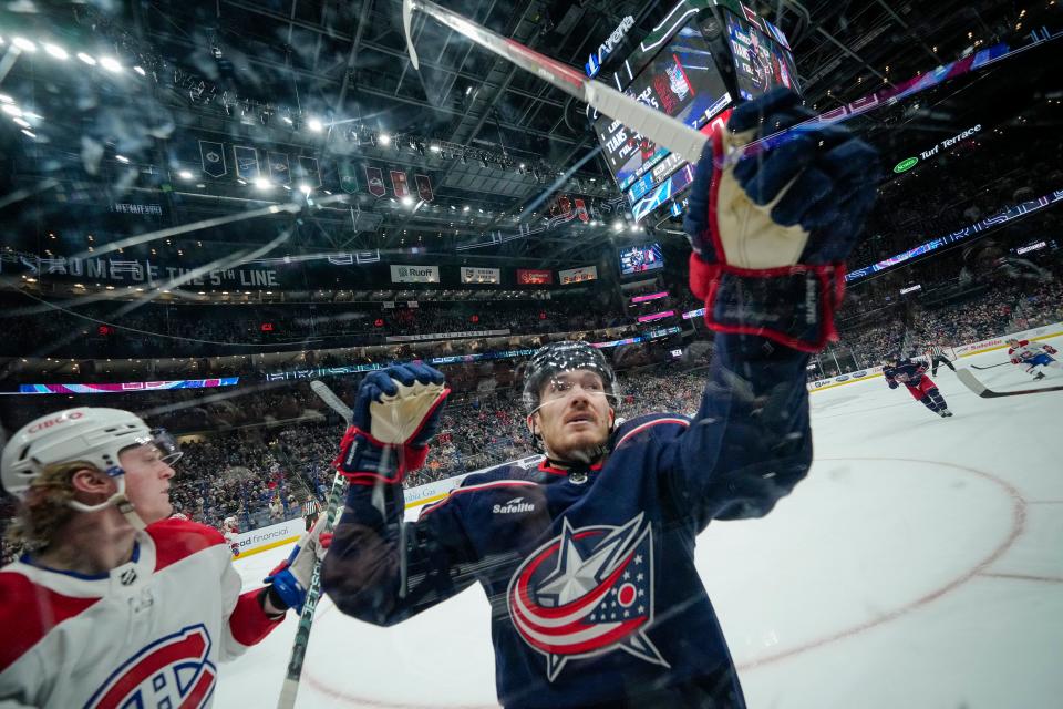 Nov 17, 2022; Columbus, Ohio, USA;  Columbus Blue Jackets center Jack Roslovic (96) tries to bat down a puck during the first period of the NHL hockey game at Nationwide Arena. Mandatory Credit: Adam Cairns-The Columbus Dispatch