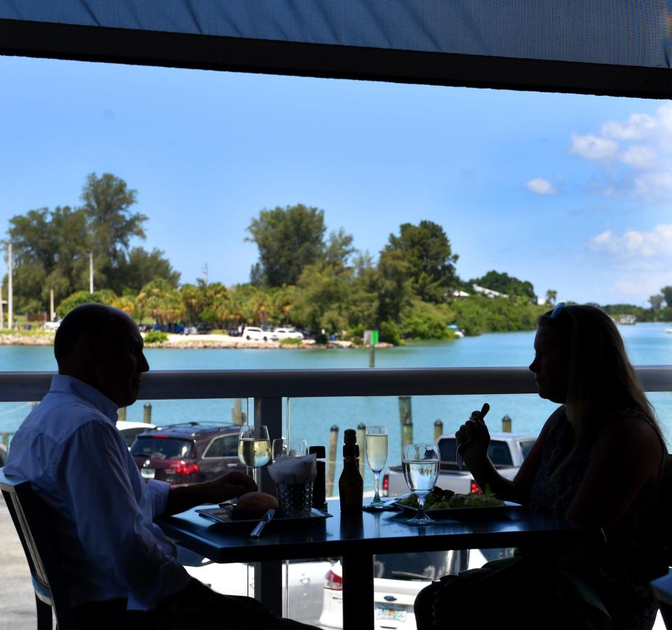 The Crow’s Nest Restaurant &amp; Marina offers an outdoor dining area with a view of the Venice Inlet.