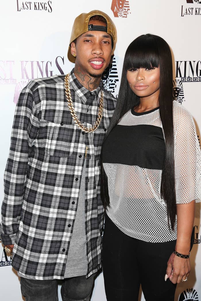 Tyga and Blac Chyna pose for a photo at a red carpet event