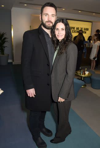 David M. Benett/Dave Benett/Getty Images From left: Johnny McDaid and Courteney Cox