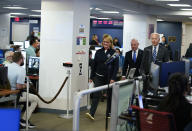 President Joe Biden, FEMA Administrator Deanne Criswell and Homeland Security Secretary Alejandro Mayorkas arrive for a briefing about the impact of Hurricane Ian during a visit to FEMA headquarters, Thursday, Sept. 29, 2022, in Washington. (AP Photo/Evan Vucci)