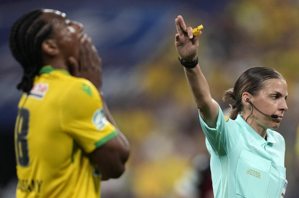 Referee Stephanie Frappart, right, gives directions during the French Cup final soccer match between Nice and Nantes at the Stade de France stadium, in Saint Denis, north of Paris, Saturday, May 7, 2022. (AP Photo/Christophe Ena)