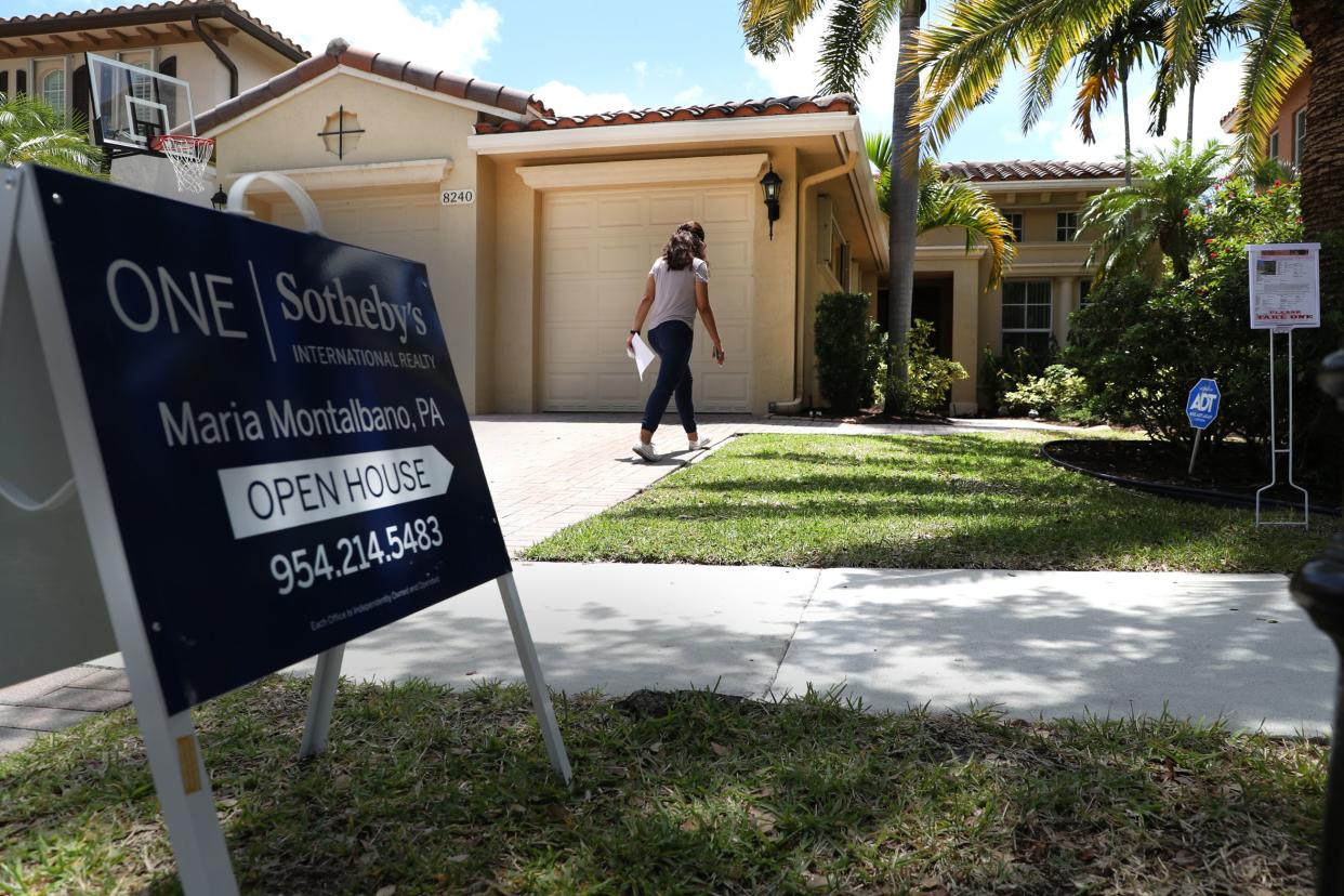 A potential buyer walks in to view a home for sale during an open house in Parkland, Florida. (Credit: Carline Jean/South Florida Sun Sentinel/Tribune News Service via Getty Images)