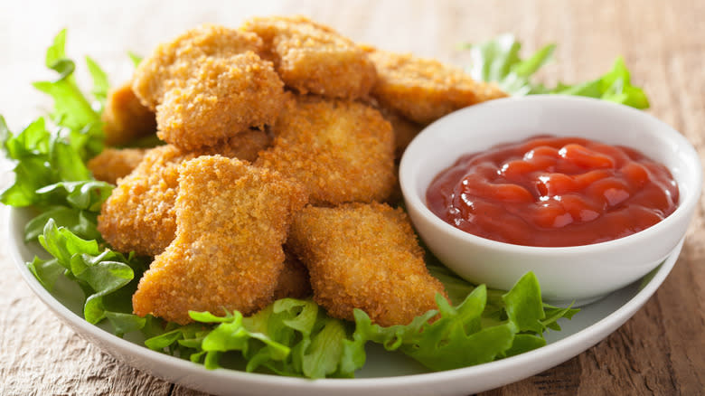 chicken nuggets plate with ketchup