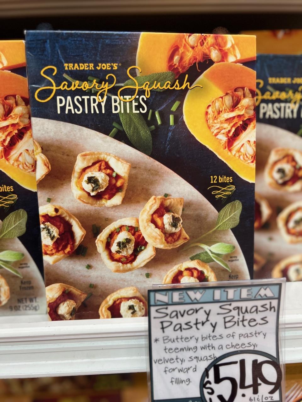 Trader Joe's Savory Squash Pastry Bites, new item sign. 12 bites with buttery pastry and cheesy filling. Price: $5.49