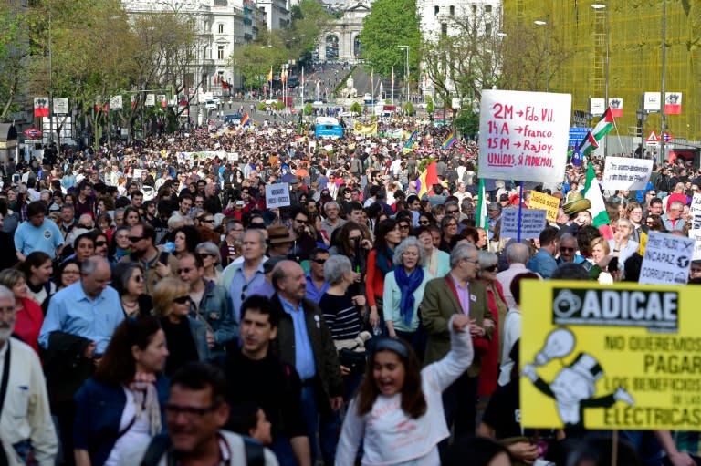 Spaniards march during a demonstration to mark the fifth anniversary of the "Indignados" movement in Madrid, on May 15, 2016