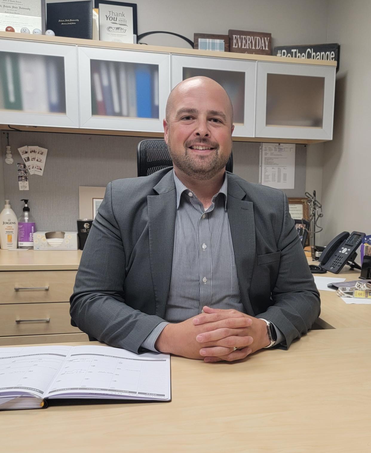 Derrick Barrios is settled into his new office in the Watertown High School.