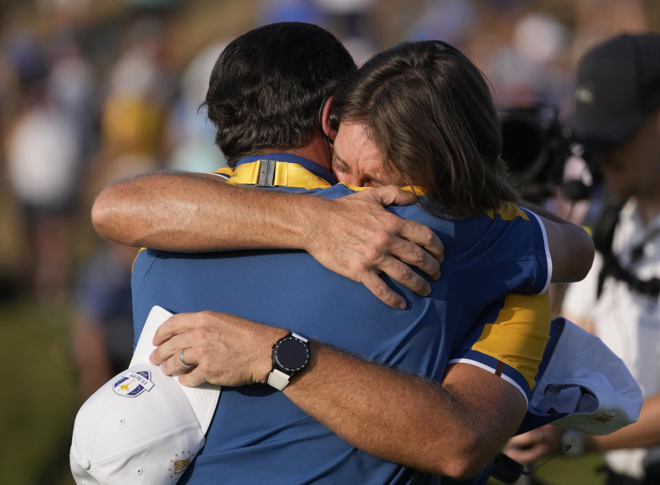 Europe's Tommy Fleetwood celebrates on the 17th green after winning his singles match at the Ryder Cup golf tournament at the Marco Simone Golf Club in Guidonia Montecelio, Italy, Sunday, Oct. 1, 2023. (AP Photo/Andrew Medichini)