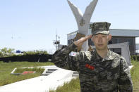 In this undated photo provided by South Korea Marine Corps' Facebook on Friday, May 8, 2020, Tottenham Hotspur forward Son Heung-min salutes at a Marine Corps boot camp in Seogwipo on Jeju Island, South Korea. Son finished his three-week military training in South Korea on Friday and was right near the top of the class.(South Korea Marine Corps' Facebook via AP).