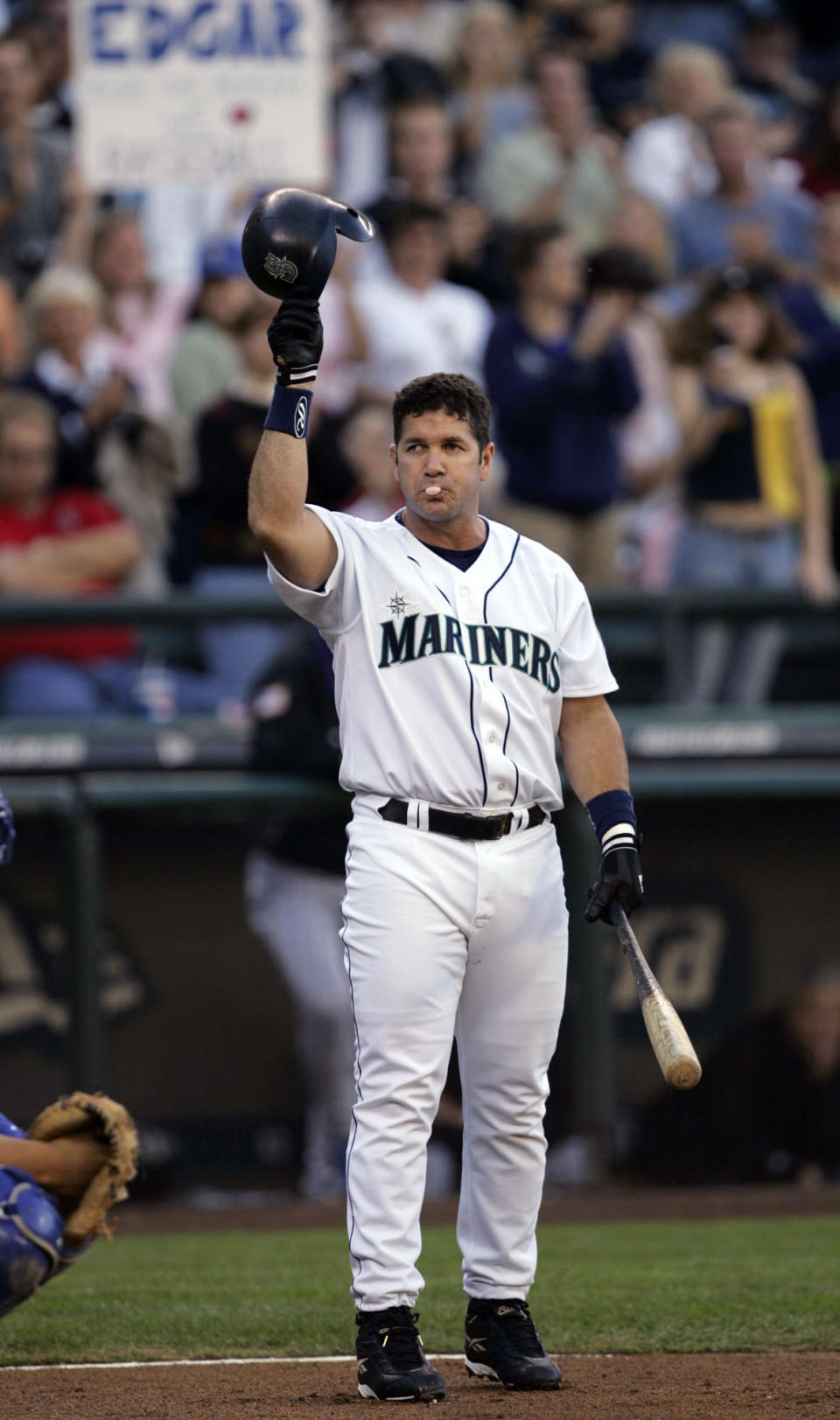 FILE - In this Oct. 2, 2004, file photo, Seattle Mariners' Edgar Martinez tips his helmet to fans as he steps to the plate in the first inning against the Texas Rangers, Saturday, Oct. 2, 2004, in Seattle. Martinez ended his major league baseball career the following day.Martinez was elected to baseball's Hall of Fame Tuesday, Jan. 22, 2019. (AP Photo/Elaine Thompson, File)