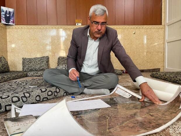 Abdullah Shrem, 46, at his home near Duhok in the Kurdistan region of Iraq. Among the tools he used to help find and rescue Yazidis captured by the Islamic State were detailed maps and a network of contacts in Iraq and Syria.  (Stephanie Jenzer/CBC - image credit)