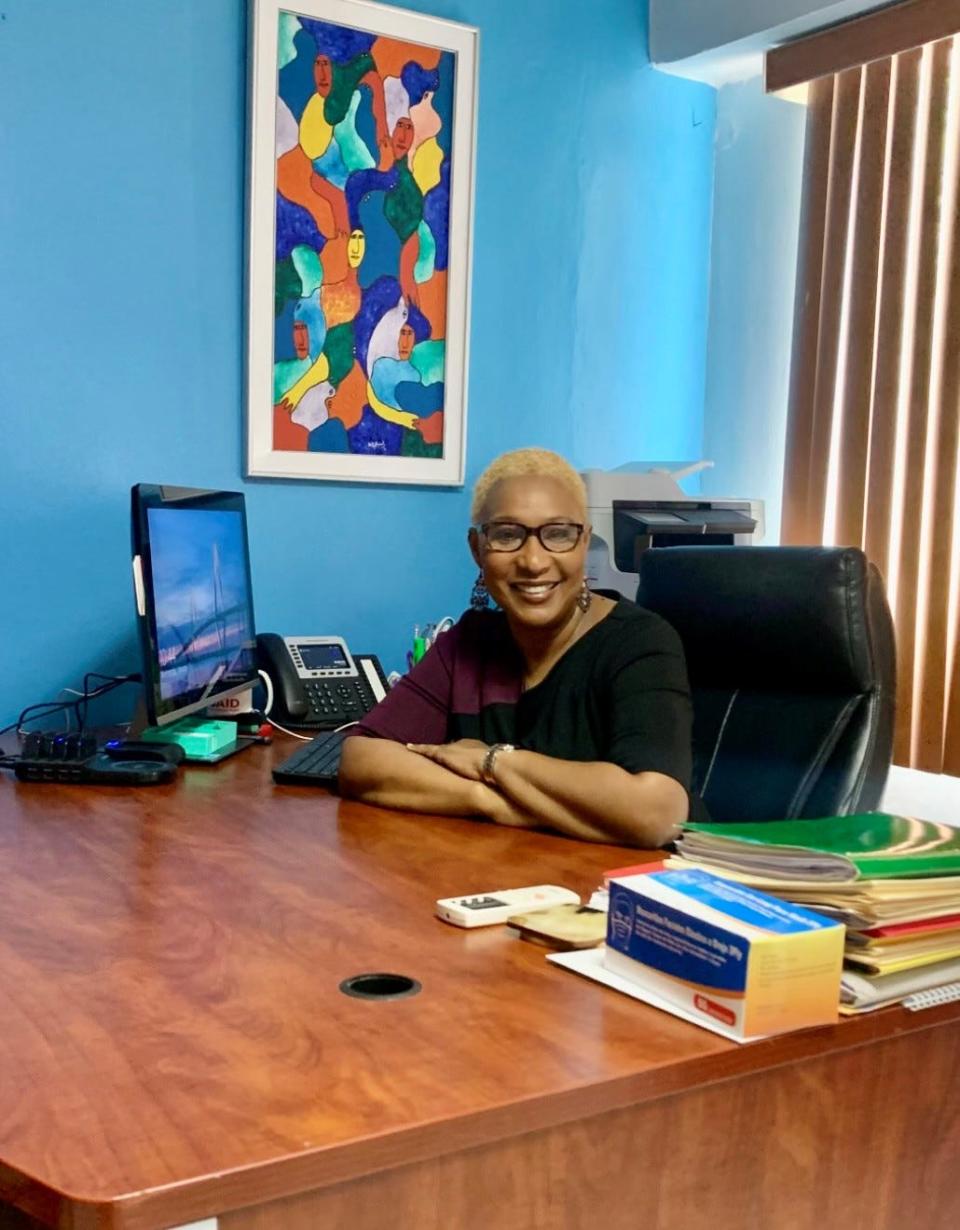 Karine Duverger at her desk in Haiti.