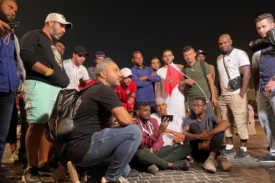 Football fans watching the Morocco v Spain game outside the Education City Stadium in Qatar (Richard Wheeler/PA) (PA Wire)