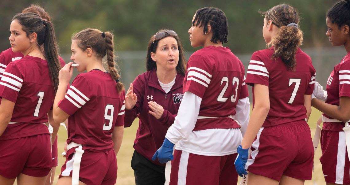 Wakefield High School flag football coach Danielle Blackburn talks to her team during a flag football scrimmage at Heritage High School in Wake Forest, N.C., Wednesday, Jan. 24, 2024.