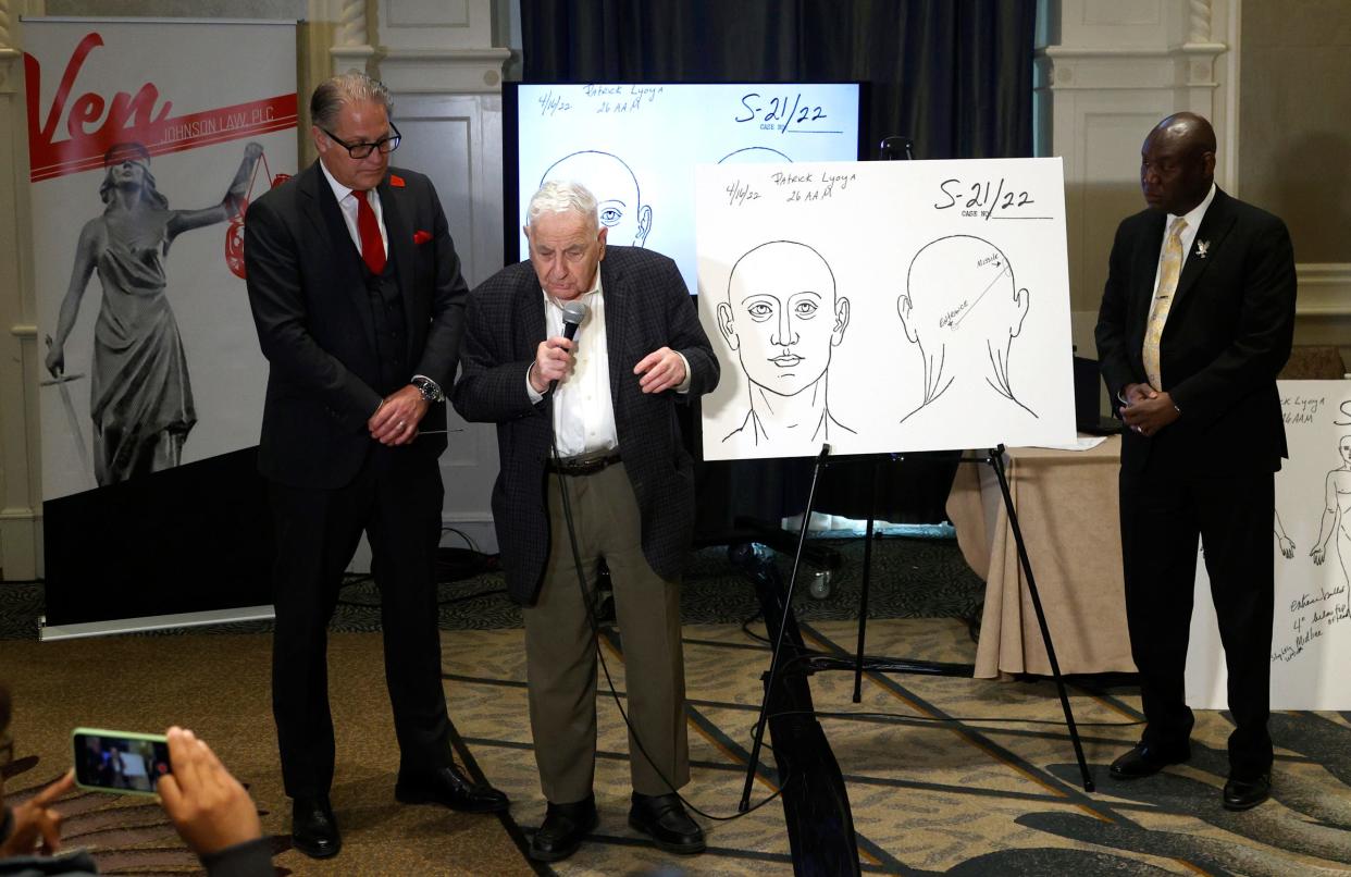 From left, Attorney Ven Johnson looks on as forensic pathologist expert Dr. Werner Spitz talks about the autopsy results of Patrick Lyoya as fellow attorney Ben Crump listens during a news conference inside of a ballroom at the Westin Book Cadillac Detroit on Tuesday, April 19, 2022 The three talked about Lyoya who was killed by a white Grand Rapids police officer who shot him in the back of the head during a stop on Monday, April 4, 2022.