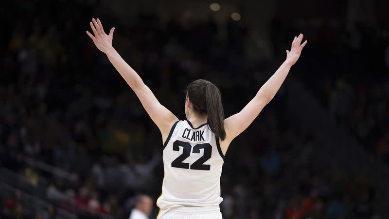 Iowa guard Caitlin Clark celebrates during the second half of an Elite Eight college basketball game against Louisville in the NCAA Tournament against Louisville, Sunday, March 26, 2023, in Seattle.