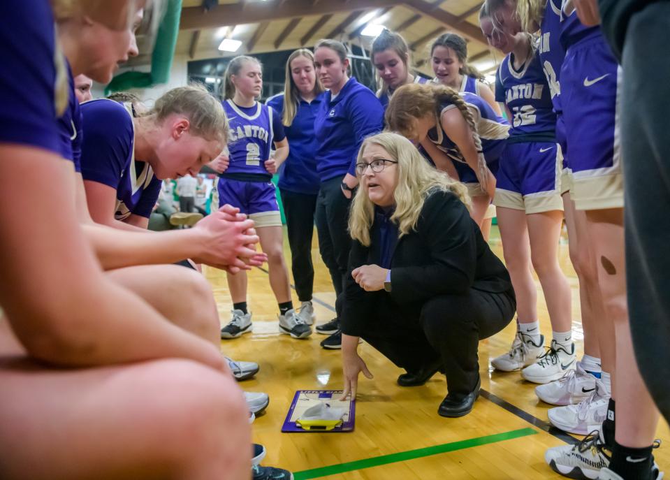 Canton head coach Maribeth Dura talks with her players during a timeout in the second half of the Class 2A Girls Basketball Eureka Regional title game between Canton and Eureka on Friday, Feb. 17, 2023 in Eureka. The Hornets defeated the Little Giants 61-55 in overtime.