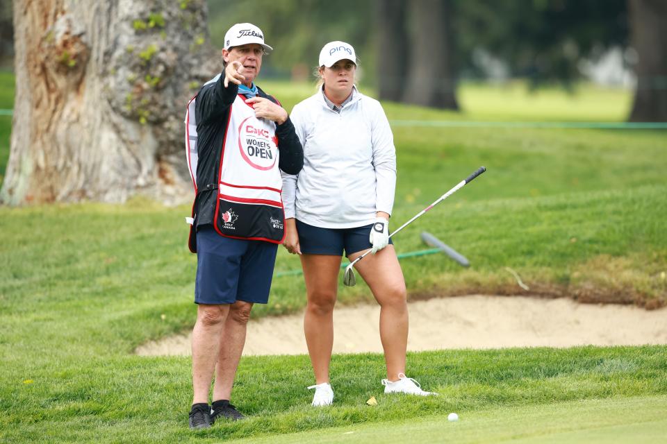 Lauren Coughlin speaks with her caddie on the10th hole during the first round of the 2024 CPKC Women's Open at Earl Grey Golf Club. (Vaughn Ridley/Getty Images)