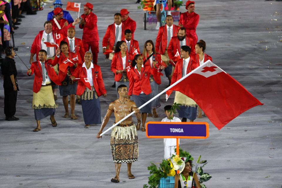 <p>Flag bearer Pita Nikolas Aufatofua of Tonga leads his Olympic Team during the Opening Ceremony of the Rio 2016 Olympic Games at Maracana Stadium on August 5, 2016 in Rio de Janeiro, Brazil. (Photo by Paul Gilham/Getty Images) </p>