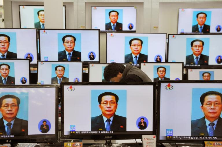 Television monitors in a shop in Seoul carry the news about the execution of Jang Song-thaek, the uncle of North Korean leader Kim Jong-Un, in December 2013