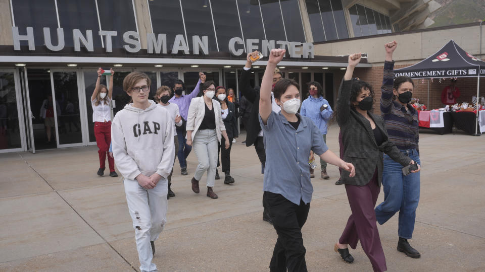 Protesters walk out during University of Utah graduation ceremonies at the Huntsman Center Thursday, May 2, 2024, in Salt Lake City. Some of those students then joined a group gathered outside, voicing their support for Palestine. (AP Photo/Rick Bowmer)