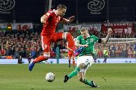 Wales's defender Chris Gunter (L) vies with Republic of Ireland's midfielder James McClean during the World Cup 2018 qualification football match March 24, 2017