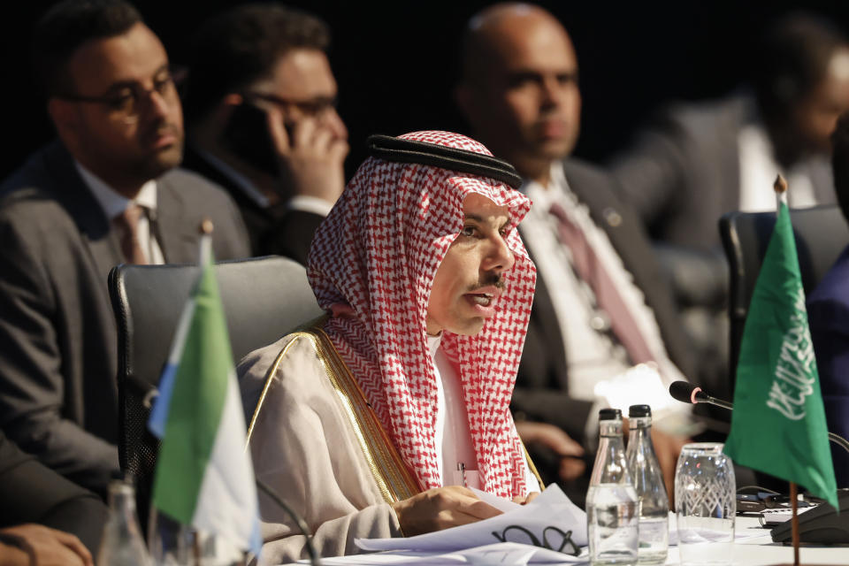 Saudi Arabia's Foreign Minister Faisal bin Farhan Al Saud attends a meeting during the 2023 BRICS Summit at the Sandton Convention Centre in Johannesburg Thursday, Aug. 24, 2023. (Marco Longari/Pool via AP)