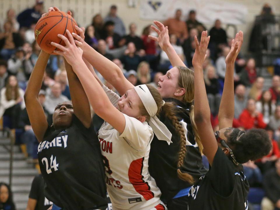 Hilton's Leah Thompson pulls down an offensive rebound from a trio of Kearney defenders, Madison Simmons, Allie Hall and Tallan McCullough in the second half.