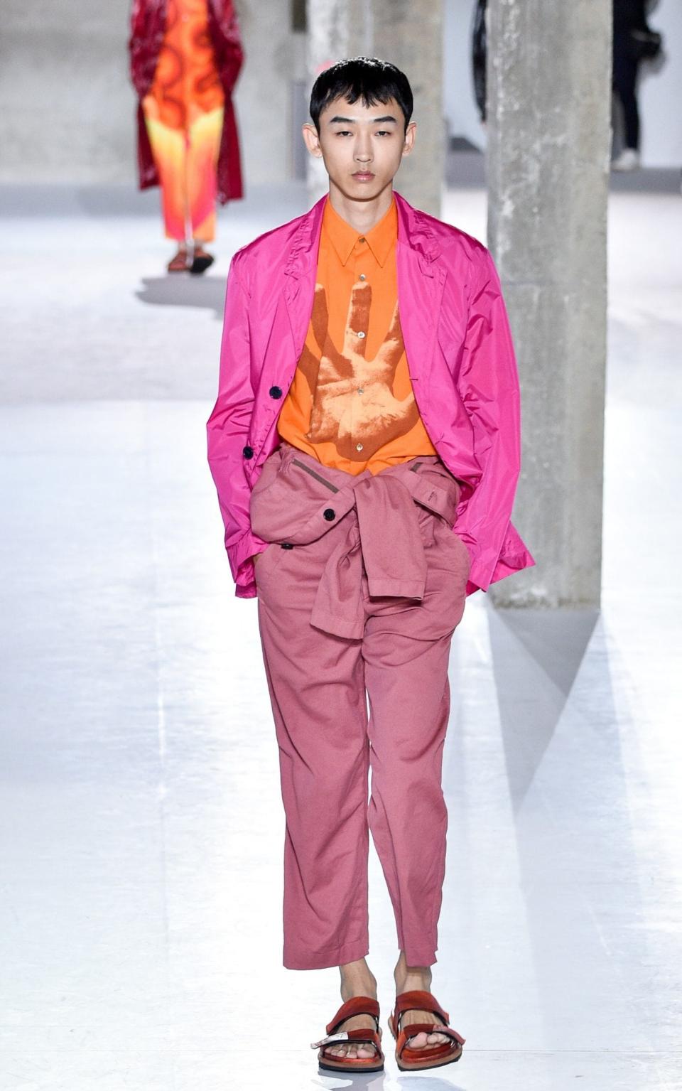 Giant hand prints on sweaters were one of the main talking points from Dries Van Noten's Paris show - Getty Images Europe