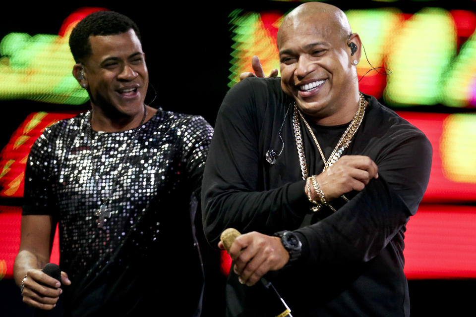 FILE - In this Feb. 22, 2018 file photo, Randy Malcom Martinez and Alexander Delgado of the Cuban duo "Gente de Zona" perform during the Vina del Mar International Song Festival at the Quinta Vergara coliseum in Vina del Mar, Chile. Platinum-selling reggaeton act Gente de Zona were barred from a New Year’s Eve concert in a Miami park on Dec. 31, 2019. As President Donald Trump tightens the trade embargo on Cuba, some members of the United States’ largest Cuban-American community are once again taking a hard line on performers like Gente de Zona who support its communist government or don’t speak out against it. (AP Photo/Esteban Felix, File)