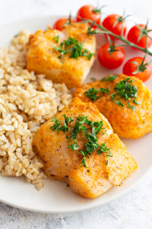 <p>Unicorns in the Kitchen</p><p>Parmesan baked cod is very easy to make and is ready in 30 minutes. Tender cod fillets are coated with a parmesan and spice combination and baked to perfection.</p><p><strong>Get the recipe: <a href="https://www.unicornsinthekitchen.com/easy-parmesan-baked-cod-recipe/" rel="nofollow noopener" target="_blank" data-ylk="slk:Easy Parmesan Baked Cod;elm:context_link;itc:0;sec:content-canvas" class="link rapid-noclick-resp"><em>Easy Parmesan Baked Cod</em></a></strong></p><p><strong>Related: 55 <a href="https://parade.com/1214569/felicialim/air-fryer-fish-recipes/" rel="nofollow noopener" target="_blank" data-ylk="slk:Best Air Fryer Fish Recipes;elm:context_link;itc:0;sec:content-canvas" class="link rapid-noclick-resp">Best Air Fryer Fish Recipes</a></strong></p>