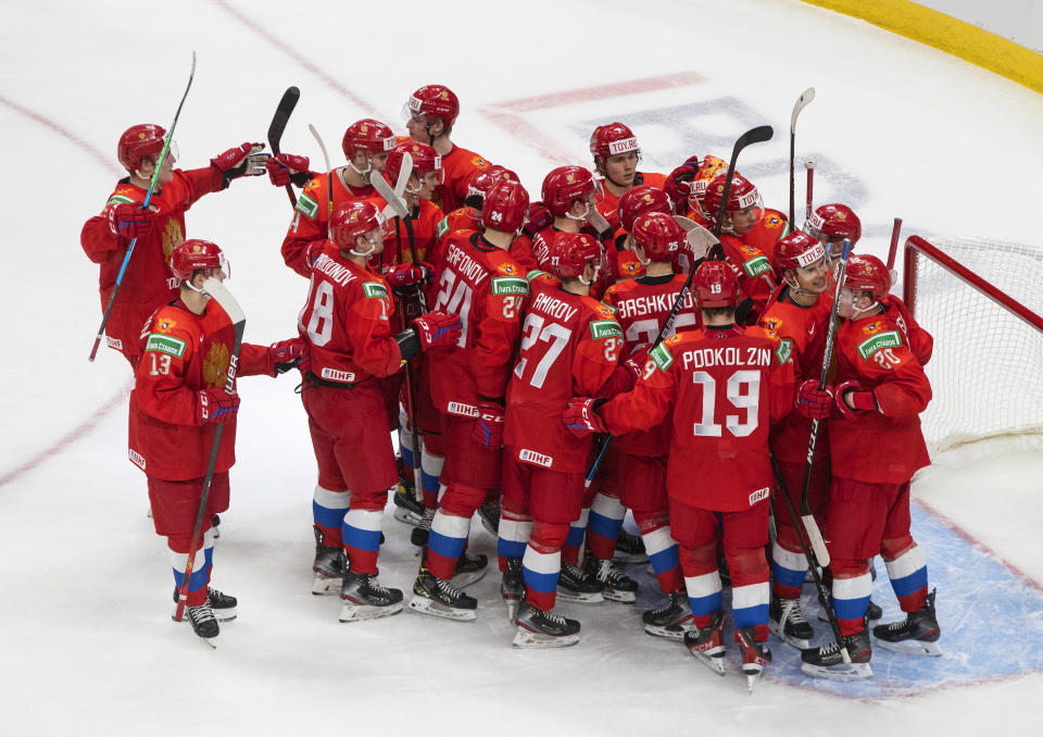 Russia players celebrates the win over Germany during an IIHF World Junior Hockey Championship game in Edmonton, Alberta, on Saturday, Jan. 2, 2021. (Jason Franson/The Canadian Press via AP)