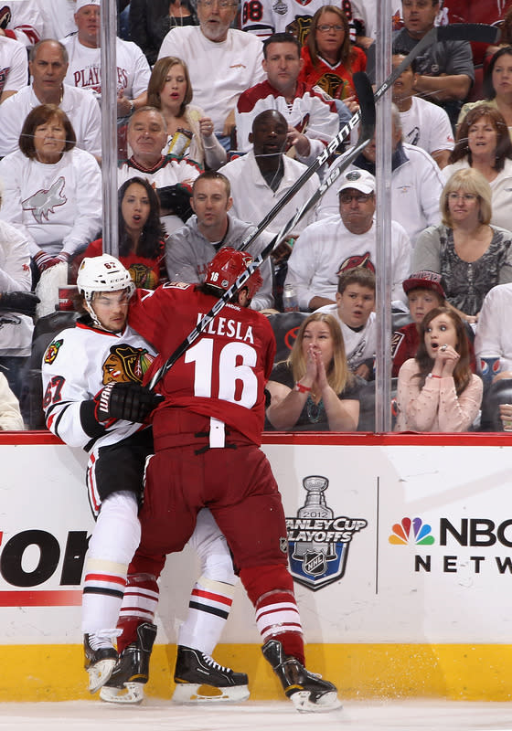   Michael Frolik #67 Of The Chicago Blackhawks Is Checked By Rostislav Klesla #16 Of The Phoenix Coyotes In The First Getty Images