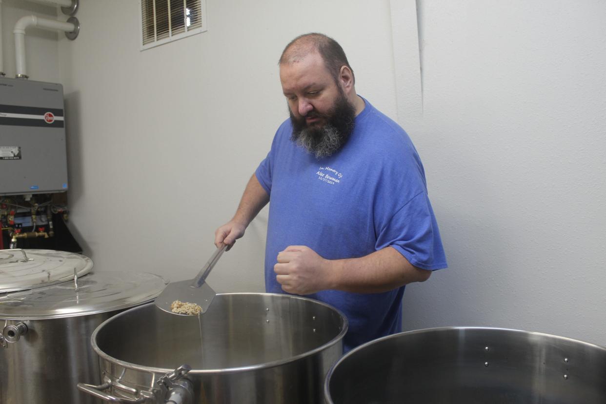 Brother Sebastian Richey points to the base grain and oatmeal for his stout.