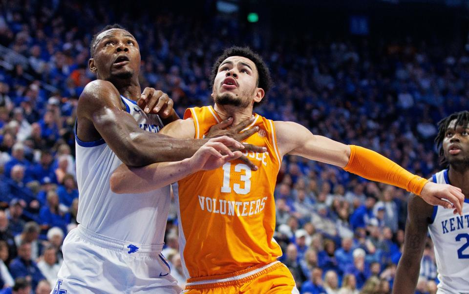 Kentucky Wildcats forward Oscar Tshiebwe (34) and Tennessee Volunteers forward Olivier Nkamhoua (13) during the first half at Rupp Arena at Central Bank Center.