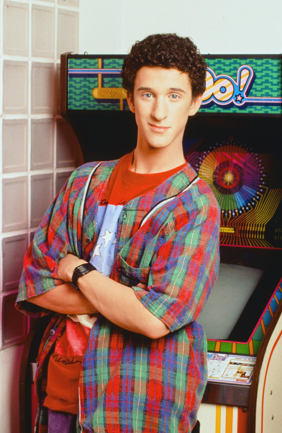 This 1992 image released by NBC shows actor Dustin Diamond as Samuel Powers, better known as Screech" from the series "Saved by the Bell." Diamond died Monday after a three-week fight with carcinoma, according to his representative. He was 44. Diamond was hospitalized last month in Florida and his team disclosed later he had cancer. (Paul Drinkwater/NBCU Photo Bank via AP)