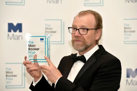 George Saunders, author of 'Lincoln in the Bardo', poses for photographers after winning the Man Booker Prize for Fiction 2017 in London, Britain, October 17, 2017. REUTERS/Mary Turner