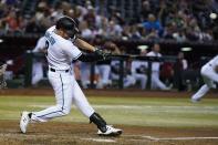 Arizona Diamondbacks' Jordan Luplow hits a three-run home run against the Kansas City Royals during the sixth inning of a baseball game Tuesday, May 24, 2022, in Phoenix. (AP Photo/Ross D. Franklin)