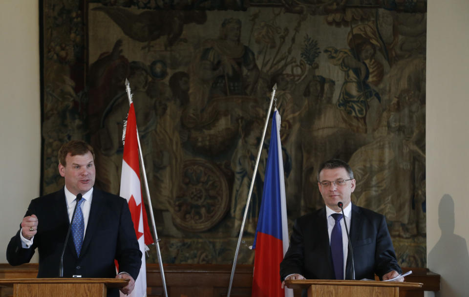 Canadian Foreign Affairs Minister John Baird, left, with his Czech Republic's counterpart Lubomir Zaoralek, right, answer questions to media during their joint press conference in Prague, Czech Republic, Tuesday, April 22, 2014. (AP Photo/Petr David Josek)