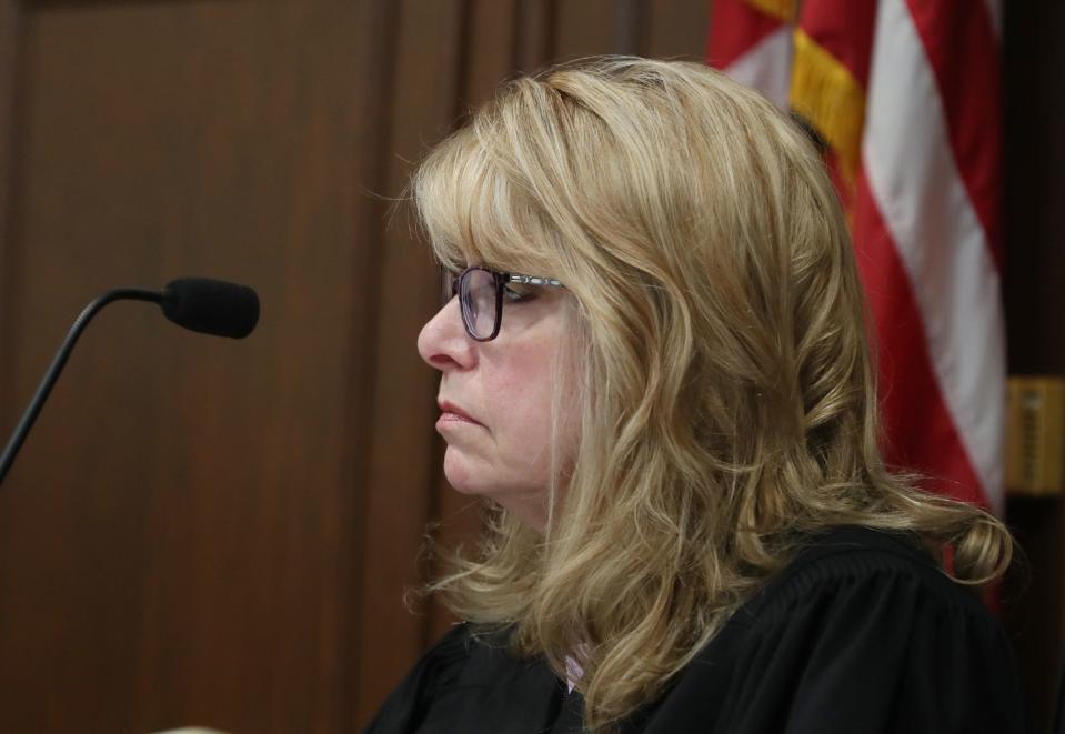 Summit County Common Pleas Judge Kelly McLaughlin listens during Sydney Powell's sentencing in her courtroom. McLaughlin sentenced Powell to 15 years to life.