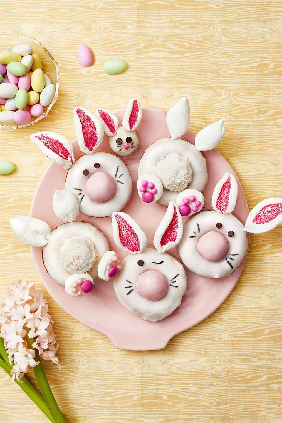 <p>Believe it or not, the bunny ears on these donuts are just marshmallows cut on a diagonal. </p><p>Get the <strong><a href="https://www.womansday.com/food-recipes/a35681614/donut-bunnies-recipe/" rel="nofollow noopener" target="_blank" data-ylk="slk:Bunny Donuts recipe.;elm:context_link;itc:0;sec:content-canvas" class="link ">Bunny Donuts recipe.</a></strong></p>