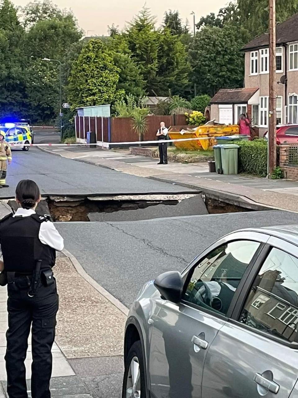 Liam Edwards, 25, who lives on Leysdown Avenue, said he heard a “massive thud” as part of the road next to his collapsed. (Liam Edwards/PA)