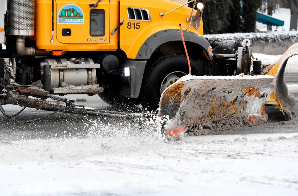 A State College Borough snow plow clears South Atherton Street on Thursday, Feb. 18, 2021.