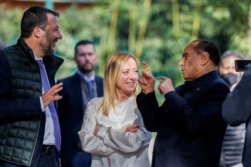 FILE PHOTO: Former Italian Prime Minister and leader of the Forza Italia party Silvio Berlusconi gestures as League leader Matteo Salvini and Brothers of Italy leader Giorgia Meloni look on at the end of their meeting in Rome